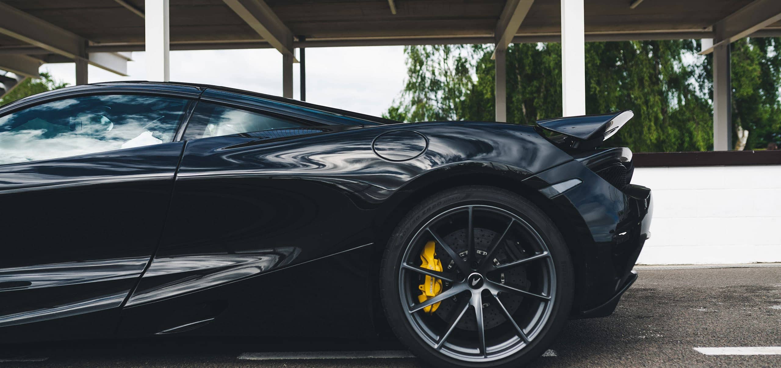 A Black Mclaren at a Salone Events Track Day