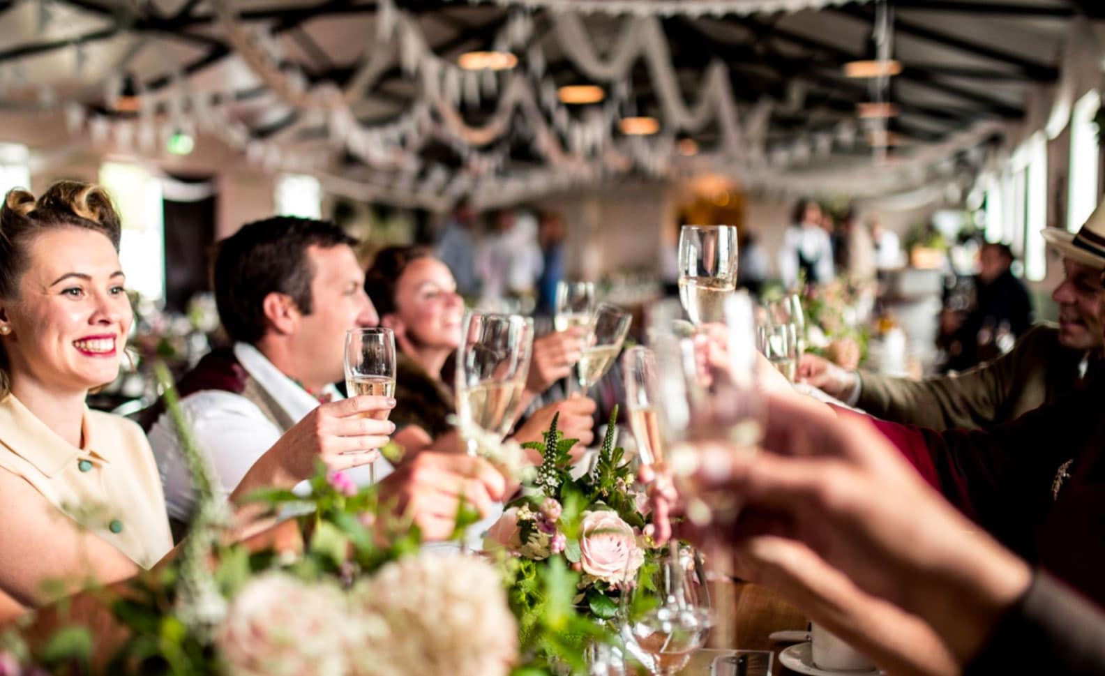 People raising a glass at a bespoke event managed by Salone Events
